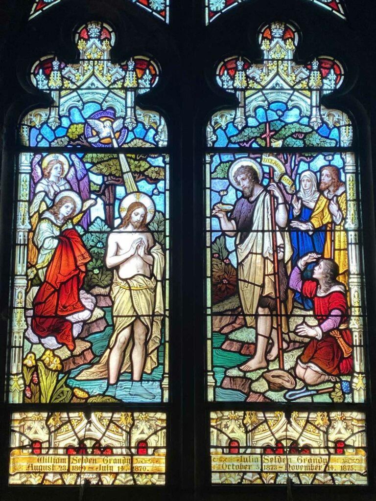 The stained glass window at Christ & St. Luke's depicting the baptism of Christ, a key moment in the season after the Epiphany.